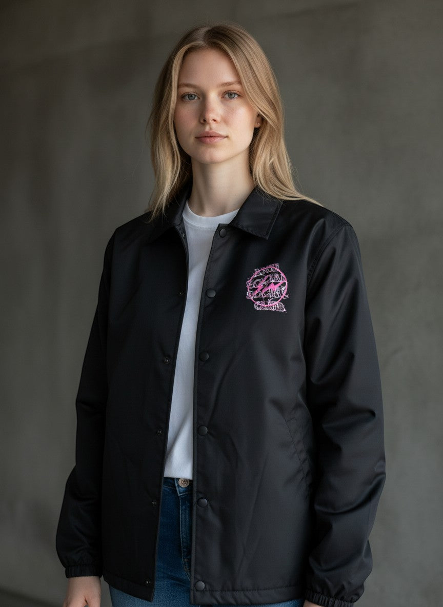 Verified Vault black coach jacket with pink Anti Social Social Club x Fragment lightning bolt logo on chest. Model wears white tee and jeans.