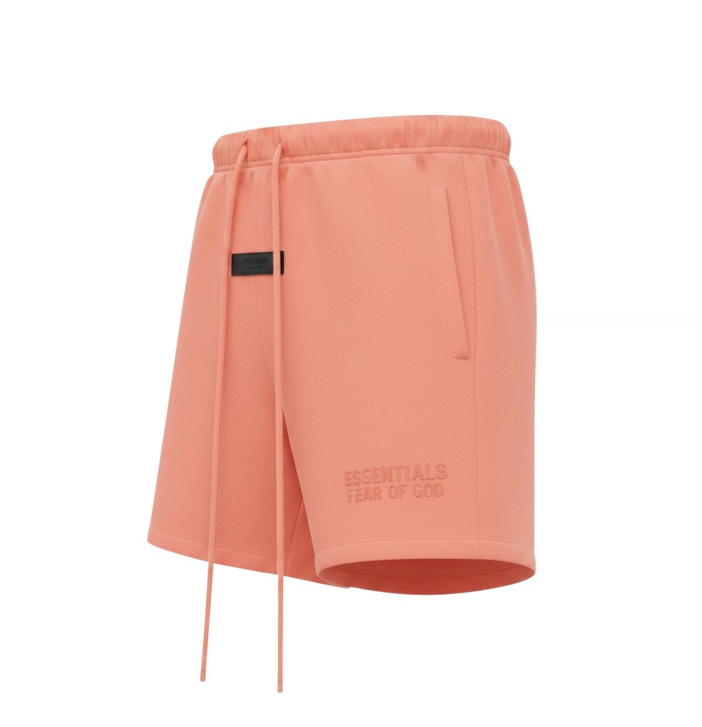 Verified Vault Fear of God Essentials coral fleece shorts with elastic waistband, drawcord, and rubberized logo patch.