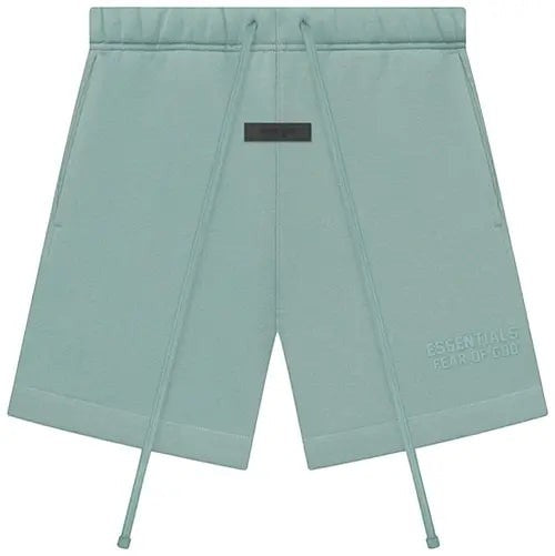 Verified Vault Fear of God Essentials sweatshorts in pale green sycamore. Wide-leg fit with drawstring and logo patch.